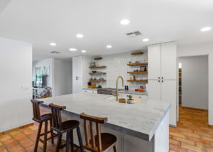 Scottsdale kitchen remodel with long galley layout and island sink view