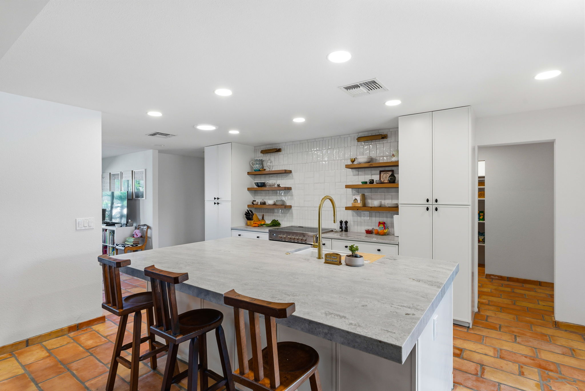 Scottsdale kitchen remodel with long galley layout and island sink view